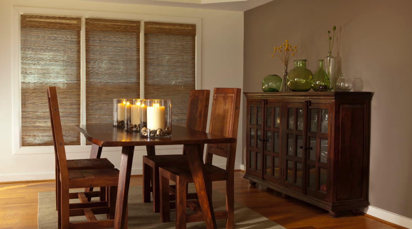 Woven shutters in a Destin dining room.